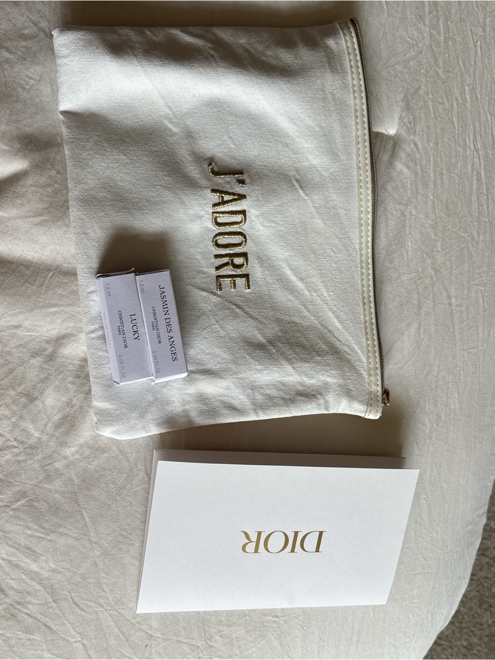 J'ADORE Embroidered White Cosmetic Pouch with Gold Lettering Two mini perfumes